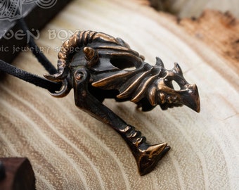 Colgante de calavera de dragón de bronce. El collar de estilo gótico es el regalo perfecto para los entusiastas de la mitología, la historia y las antigüedades.