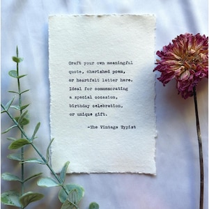 May include: A rectangular piece of off-white textured paper with deckled edges featuring black typewriter text that reads: Craft your own meaningful quote, cherished poem, or heartfelt letter here. Ideal for commemorating a special occasion, birthday celebration, or unique gift. -The Vintage Typist.