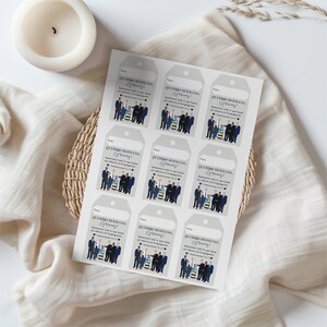 May include: A sheet of gray gift tags with a blue and white illustration of a group of people. The text on the tags reads "Querido Hermano, &iexcl;Gracias!" which translates to "Dear Brother, Thank You!"