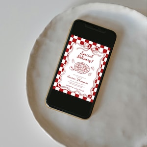 May include: A smartphone displays a red and white checkered pizza-themed invitation. The invitation features the text "Special Delivery!" and the name "Lauren Thompson". The phone rests on a white, round plate.
