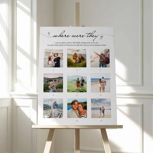 May include: A white sign on an easel with the text "where were they" and nine photo squares. The sign is for a wedding game, asking guests to guess the locations in the photos. The sign is displayed in a bright room with a window.