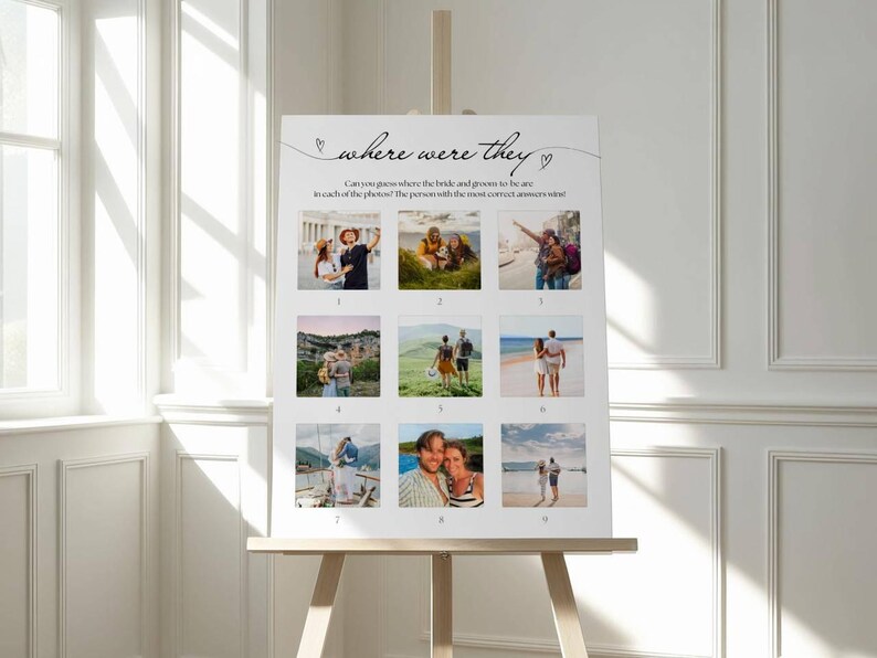 May include: A white sign on an easel with the text "where were they" and nine photo squares. The sign is for a wedding game, asking guests to guess the locations in the photos. The sign is displayed in a bright room with a window.