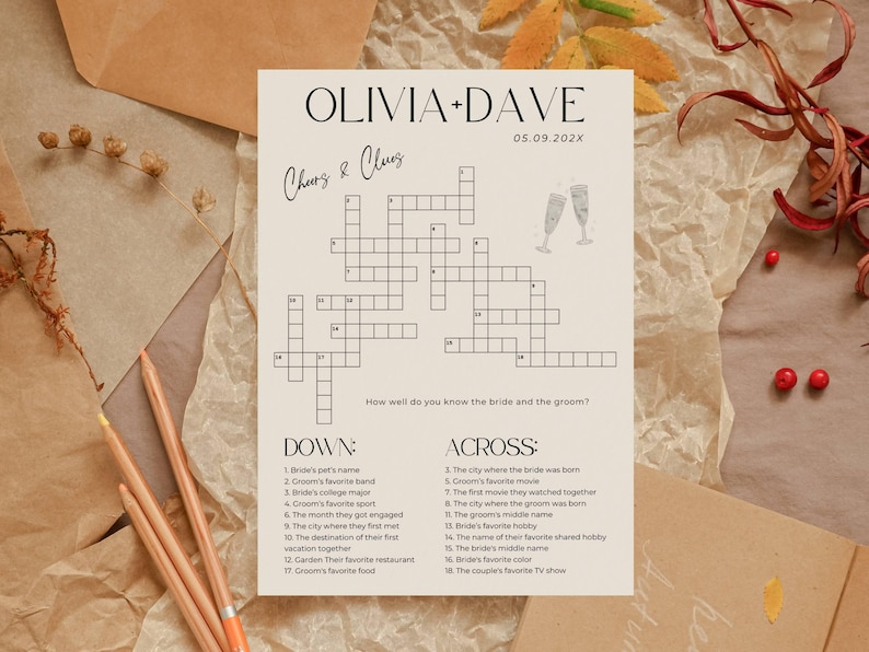 K&ouml;nnte beinhalten: Ein cremefarbenes Hochzeitskreuzwortr&auml;tsel mit den Namen "OLIVIA + DAVE" und dem Datum "05.09.202X" oben. Das R&auml;tsel enth&auml;lt Hinweise und eine Champagnerglas-Illustration. Das Thema sind Hochzeitsspiele.
