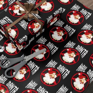 May include: Black and red wrapping paper with a repeating pattern of a pentagram with a Santa Claus head inside. The text "Hail Santa" is repeated throughout the pattern.