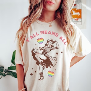 Y&#39;all Means All Cowgirl LGBTQ Feminist Comfort Colors Shirt Retro Western Graphic Tee Gay Rights Tee Lesbian Queer Rights Trans Rainbow Flag