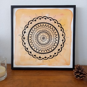 LYSA, irradia - incorniciato - Mandala arancione e nero
