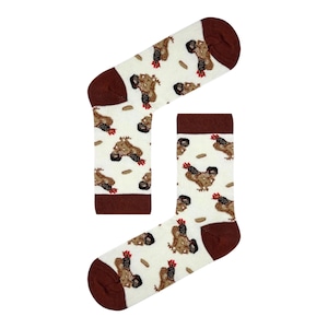 May include: Novelty socks featuring a repeating pattern of brown chickens and small brown ovals on a cream background. The heel and toe sections are solid brown.