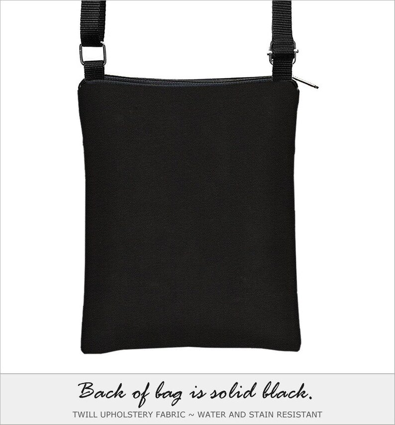 May include: Black crossbody bag with a black adjustable strap and a zipper closure. The bag is made of twill upholstery fabric and is water and stain resistant. The back of the bag is solid black.