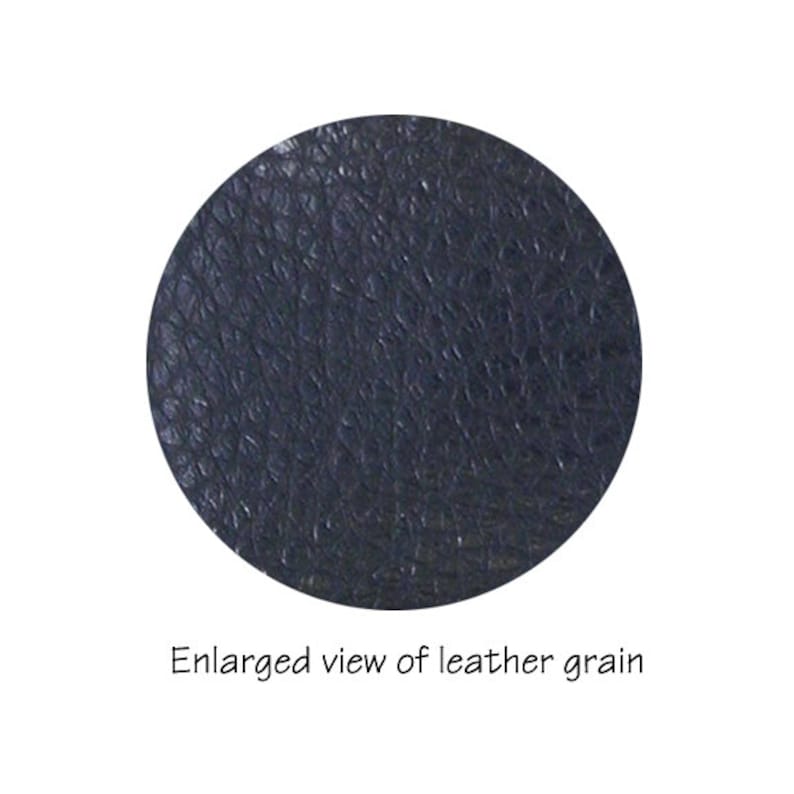 May include: Close-up of a dark blue leather grain texture.
