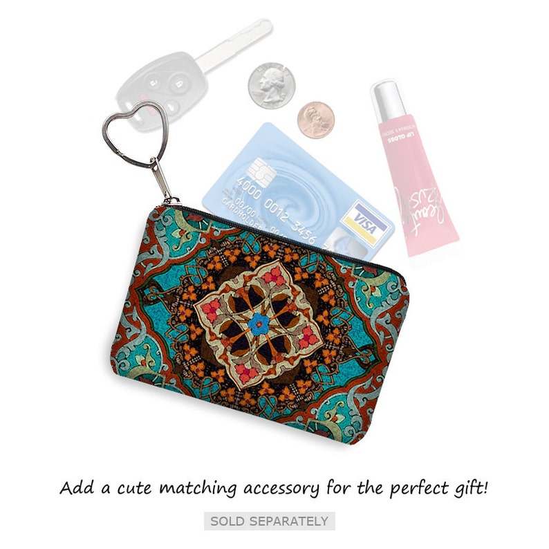 May include: A small, teal zippered pouch with a colorful, intricate geometric pattern. The pouch is open and has a credit card, a key, and a tube of lip gloss inside.