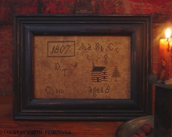 Patrón de punto de cruz E del muestreador de cabaña primitivo de 1807 (PDF)