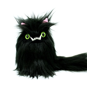 Black cat with green eyes stuffed animal best sale