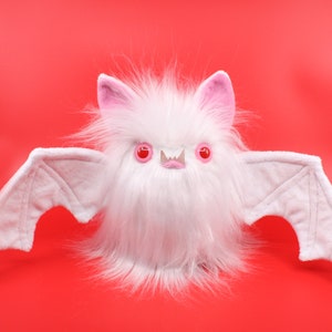 The Bat plush in white and pink