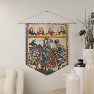 May include: Medieval tapestry wall hanging featuring a battle scene with knights in armor, swords, and horses. The artwork has a vintage, aged appearance with a decorative border and a row of figures at the top. The tapestry is suspended from a wooden rod.