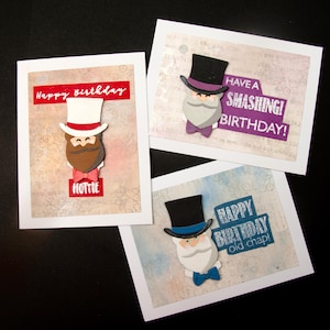 May include: Three handmade birthday cards with white borders. Each card features a cartoon gentleman with a top hat, beard, and bow tie. One card says "Happy birthday" and "Hottie", another says "Have a smashing birthday!", and the last says "Happy birthday old chap!"