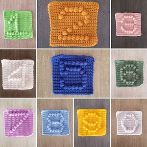 Può includere: Nove quadrati all'uncinetto, ognuno con un numero diverso da uno a nove, realizzati con filato colorato. I quadrati sono disposti in una griglia.