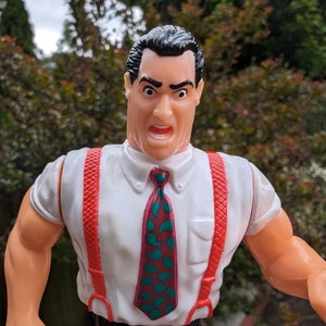 Vintage 1990s WWf WWe Hasbro Titan Sports IRS Irwin R Schyster wrestling figure