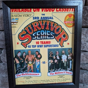 May include: A framed poster advertising the 3rd Annual Survivor Series, a WWF wrestling event. The poster features the Hulkamaniacs vs. The Million Dollar Team, with 10 teams and 40 WWF superstars. The poster also includes the text "Available on Video Cassette" and "World Wrestling Federation Official Video".