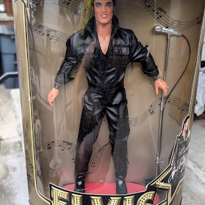 Vintage 1996  Elvis Presley Elvis 68 Special doll in original box never opened.