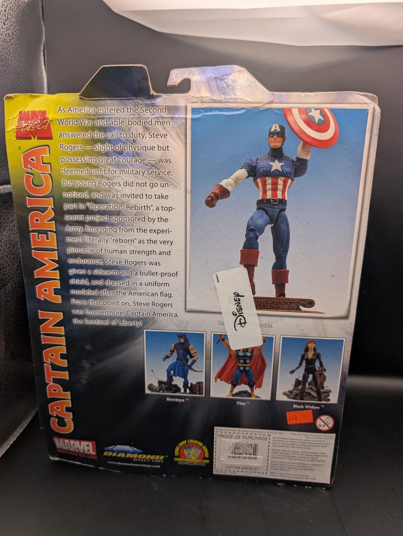 May include: Captain America action figure in a box. The figure is in a classic pose, holding his shield. The packaging features text about the character's origin and other Marvel characters. The box has a Disney tag.