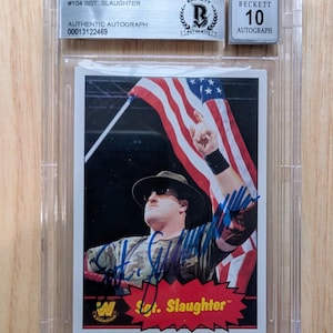 Autographed Sgt. Slaughter Topps Heritage Trading Card Beckett Authenticated with an Autograph Grade Of 10