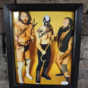 Autographed WWF WWE Hacksaw Jim Duggan and The Grappler Rare! 8x10 inch framed photo with certificate of authenticity from JSA