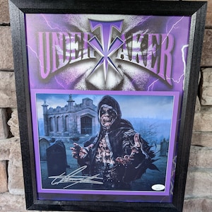 Autographed WWE WWF The Undertaker 11x14 inch framed photo With Certificate Of Authenticity From JSA
