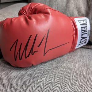 Autographed Mike Tyson Boxing Glove with certificate of authenticity from Fiterman Sports