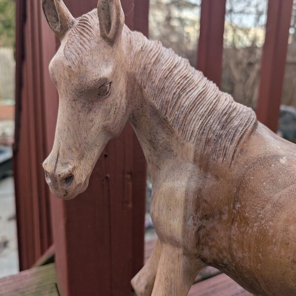 Hand Carved Teak Wood Horse Statue from Bali. Hand carved from a single piece of wood