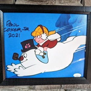 Foto enmarcada de 8 x 10 pulgadas con certificado de autenticidad de JSA, autografiada por Paul Coker Jr., animador de Frosty The Snowman.