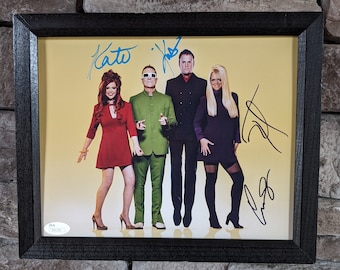 Autographed The B-52s full band signed 8x10 inch framed photo with certificate of authenticity from JSA.