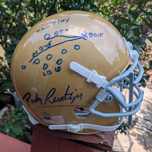 Autographed Rudy Ruettiger Riddell Mini Helmet The Play Inscription with certificate of authenticity from JSA
