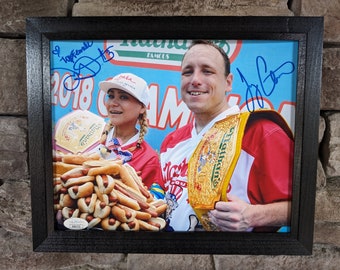 Autographed Joey Chestnut and Miki Sudo Nathan's Hotdog eating champions. 8x10 inch framed photo with certificate of authenticity from JSA