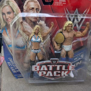 Vintage Mattel Toys  WWF WWE Battle Pack Series 41 Ric Flair and Charlotte Flair ln original box never opened.