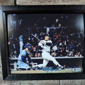 Autographed Reggie Jackson Mr. October N.Y. Yankees 8x10 inch framed photo with certificate of authenticity from JSA