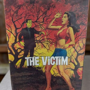 May include: A vintage box for a plastic model kit depicting a woman running from Frankenstein's monster in a forest fire. The box reads "Moebius Monster Scenes All Plastic Snap Together Custom Builder Kits The Victim TM".