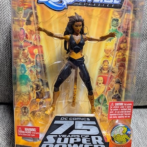 May include: A plastic package containing a DC Universe Classics action figure of Cheetah, a female superhero with a cheetah-like costume. The figure is posed with arms outstretched and a fierce expression. The packaging features the DC Comics 75 Years of Super Power logo and includes a collector button.