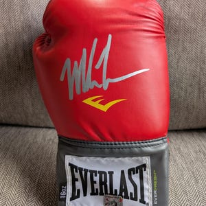 Autographed Mike Tyson Boxing Glove with certificate of authenticity from JSA