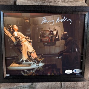 Autographed Daisy Ridley Rey in Star Wars . 8x10 inch framed photo with certificate of authenticity from JSA