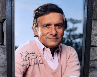 Autographed Hugh Hefner Playboy Magazine founder. 8x10 inch framed photo with certificate of authenticity from JSA