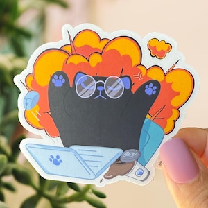 May include: A black cat wearing glasses sits in a chair with a laptop and a cup of coffee. The cat is surrounded by a red and orange explosion.