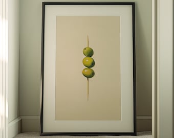 Peut inclure: Une impression encadrée d'une nature morte représentant trois olives vertes sur une brochette sur un fond beige.