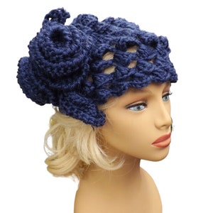 a mannequin head wearing a blue crocheted hat