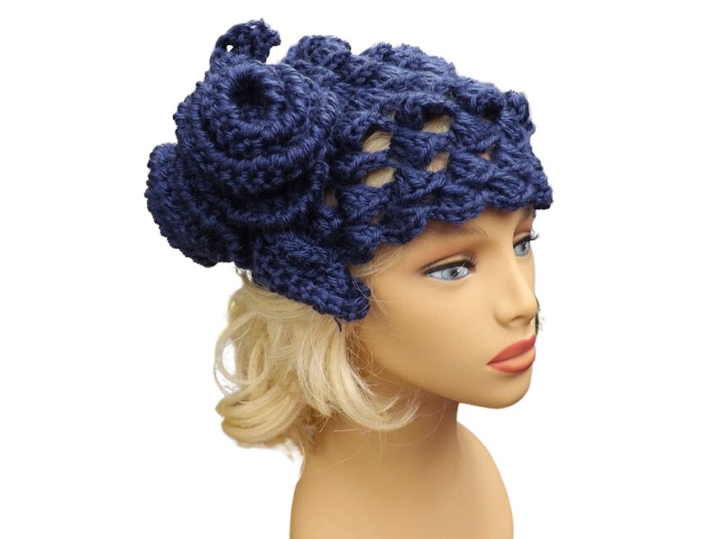 a mannequin head wearing a blue crocheted hat