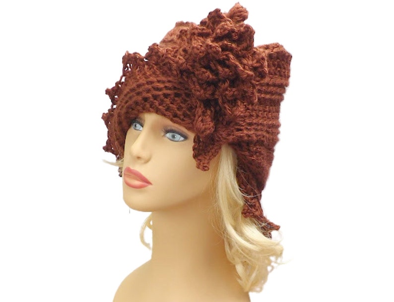 a crocheted hat on a mannequin head