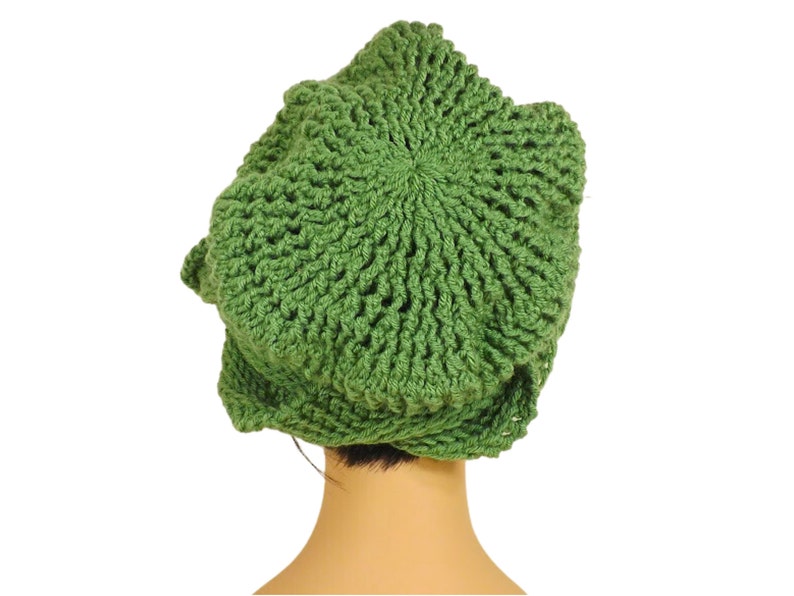 Unique Möbius Crochet Hat Pattern - Samantha Slouchy Beanie with Twist Brim. The green knit slouchy beanie hat with twisted brim modeled on a mannequin head, viewed from a slightly lower angle showing more of the top of the hat.