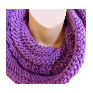 a purple knitted scarf on a mannequin
