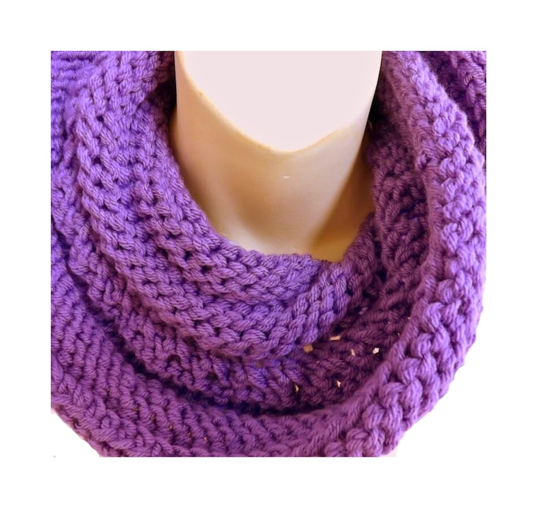 a purple knitted scarf on a mannequin