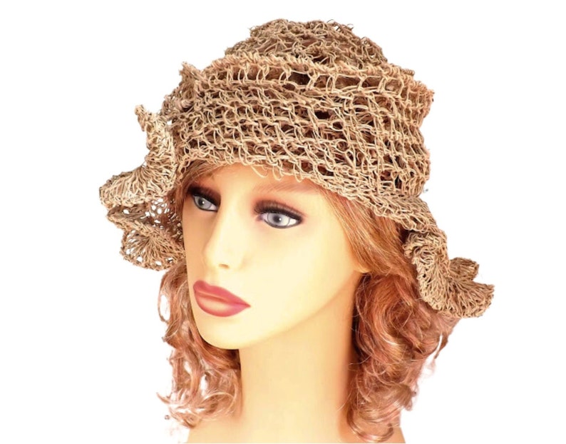 a mannequin head wearing a natural hemp twine hat with a diagonal ruffle