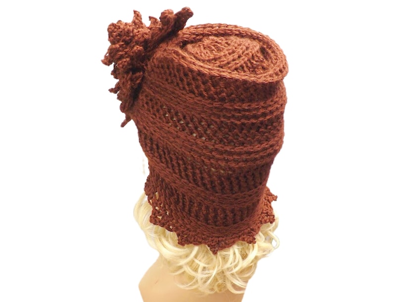 a crocheted hat on a mannequin head